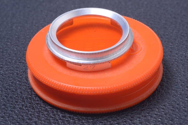 CENEIPLAN, CENEI ORANGE 27MM FILTER GENUINE LENS OR CAMERA PUSH W/ KEEPER 27-3