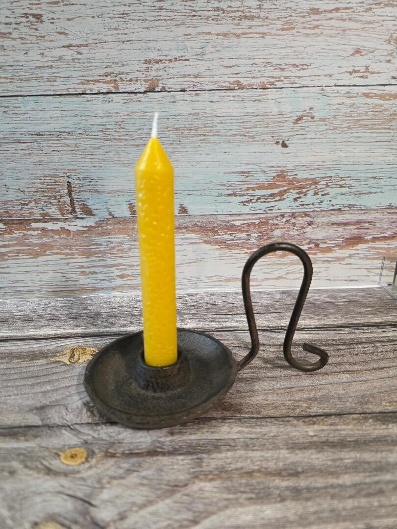 small yellow taper candle