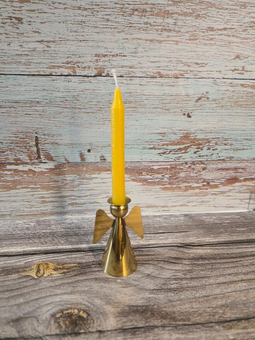 tiny yellow taper candle