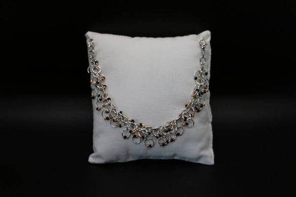 Armkette schwarz-gold