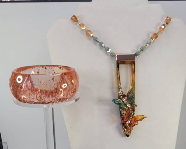 Tiny Butterflies and  Sparkling Crystals adorn Orangy Resin Art Necklace