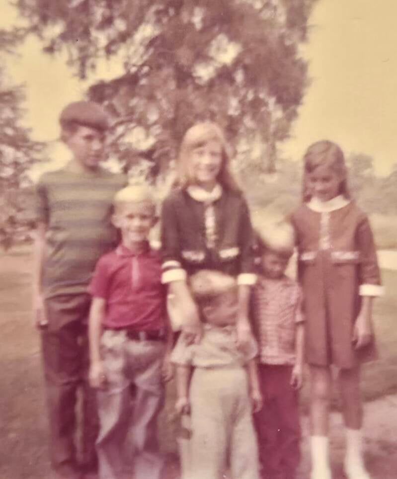 School kids joined by younger brothers