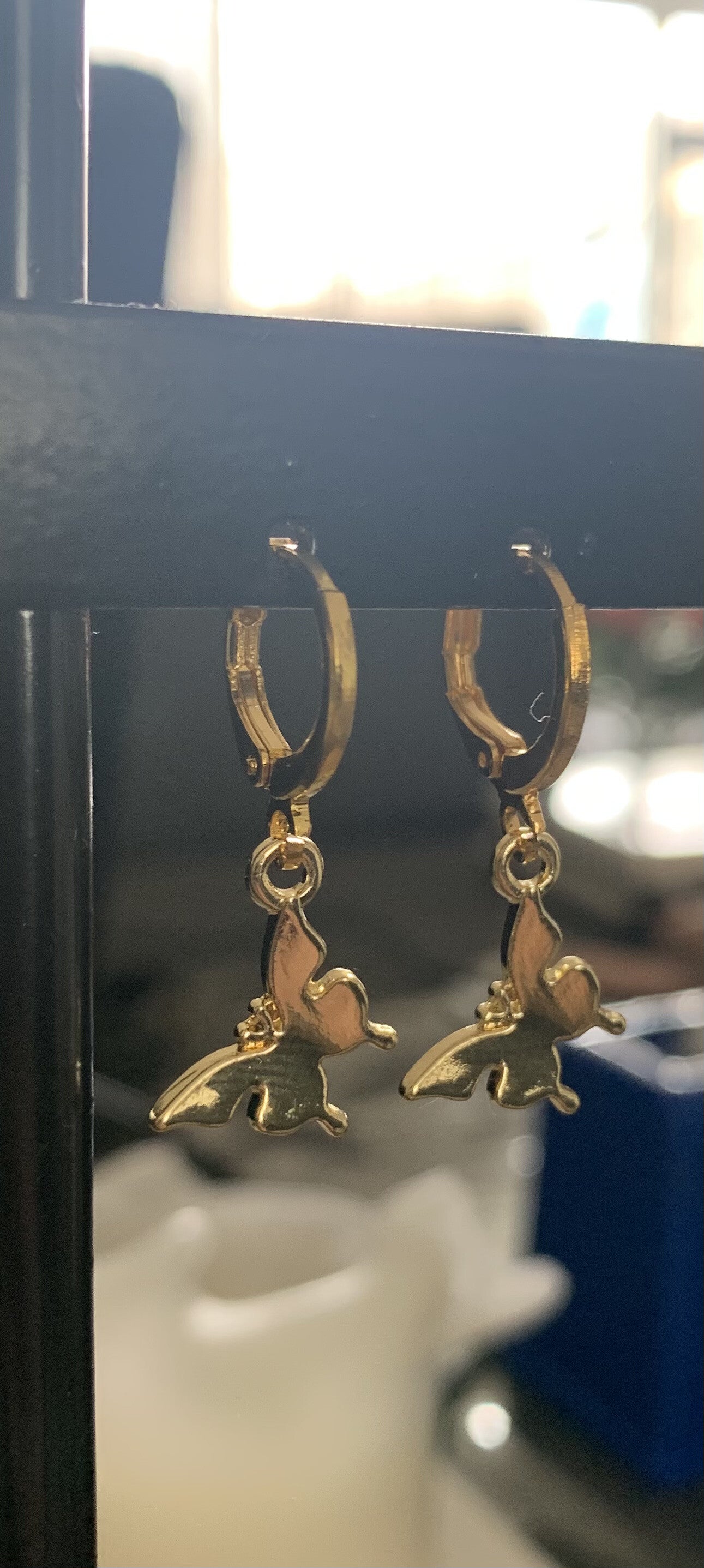 The gold butterfly earrings