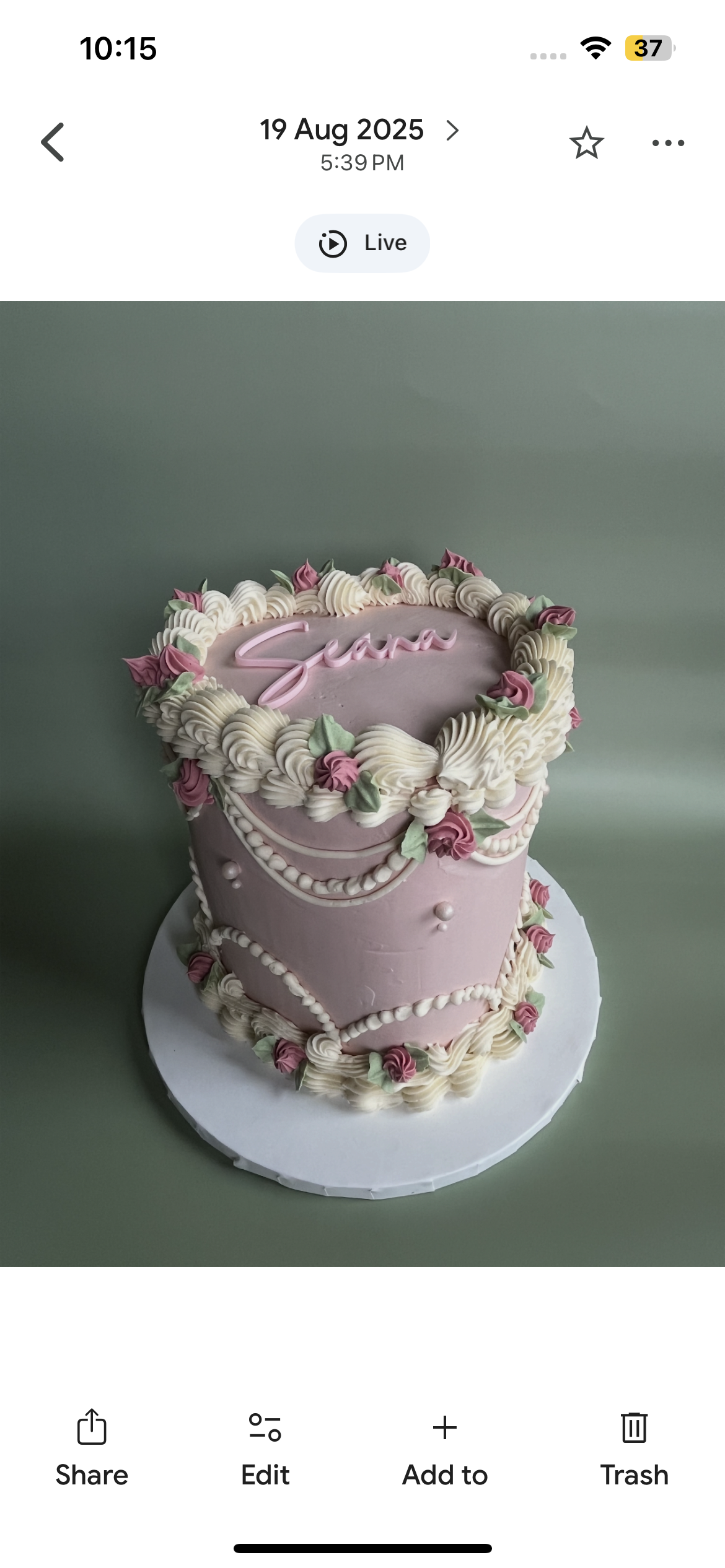 Red and pink decorated Valenines Day cupcakes in a box of 6 with pink and red piped icing on top.