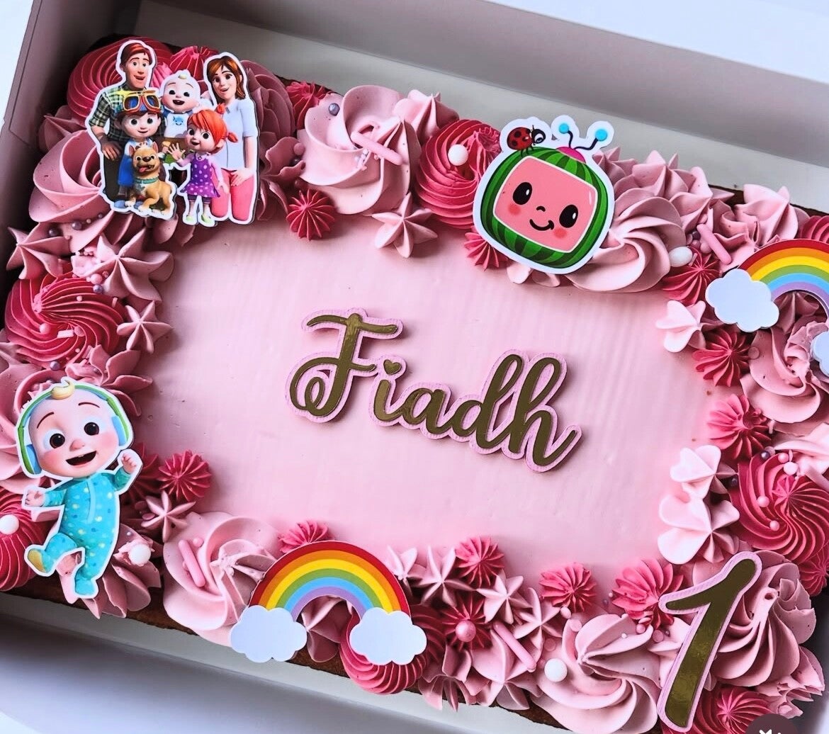 Celebration traybake Cocomelon  birthday, iced in swiss meringue buttercream pink decoration