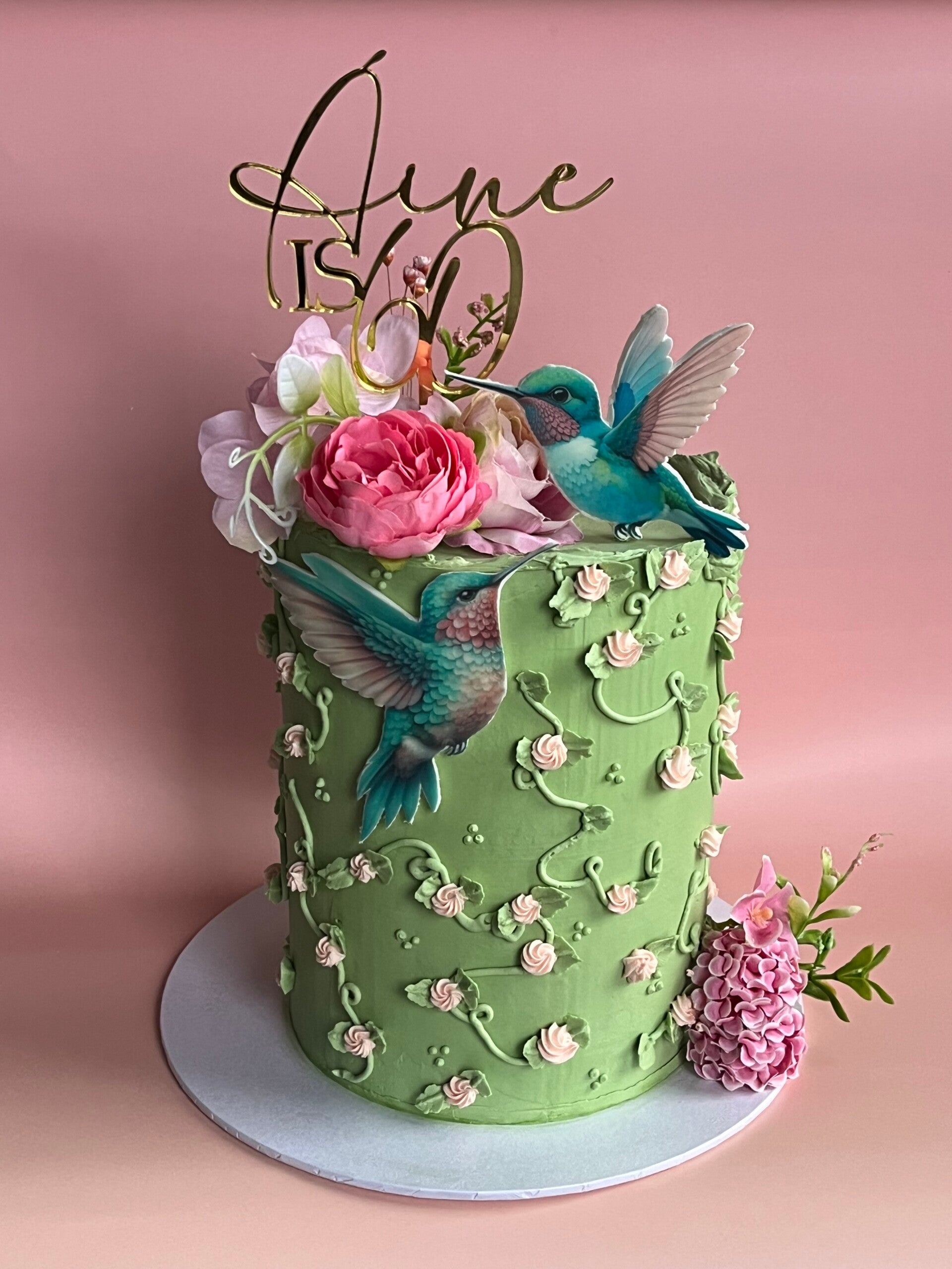 40th birthday cake in swiss meringue buttercream with cream drip and flower topper