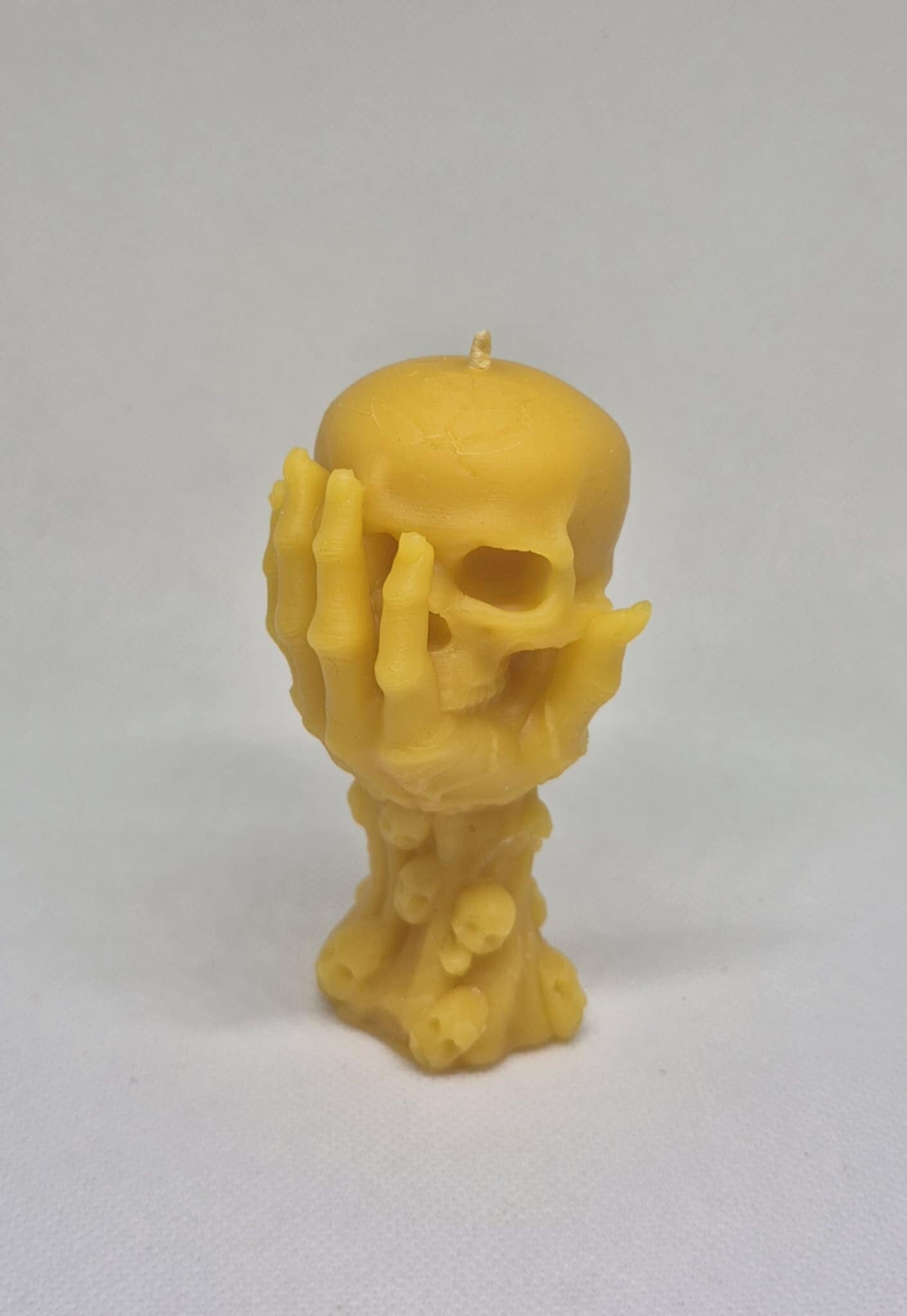 Hand Holding Skull Candle