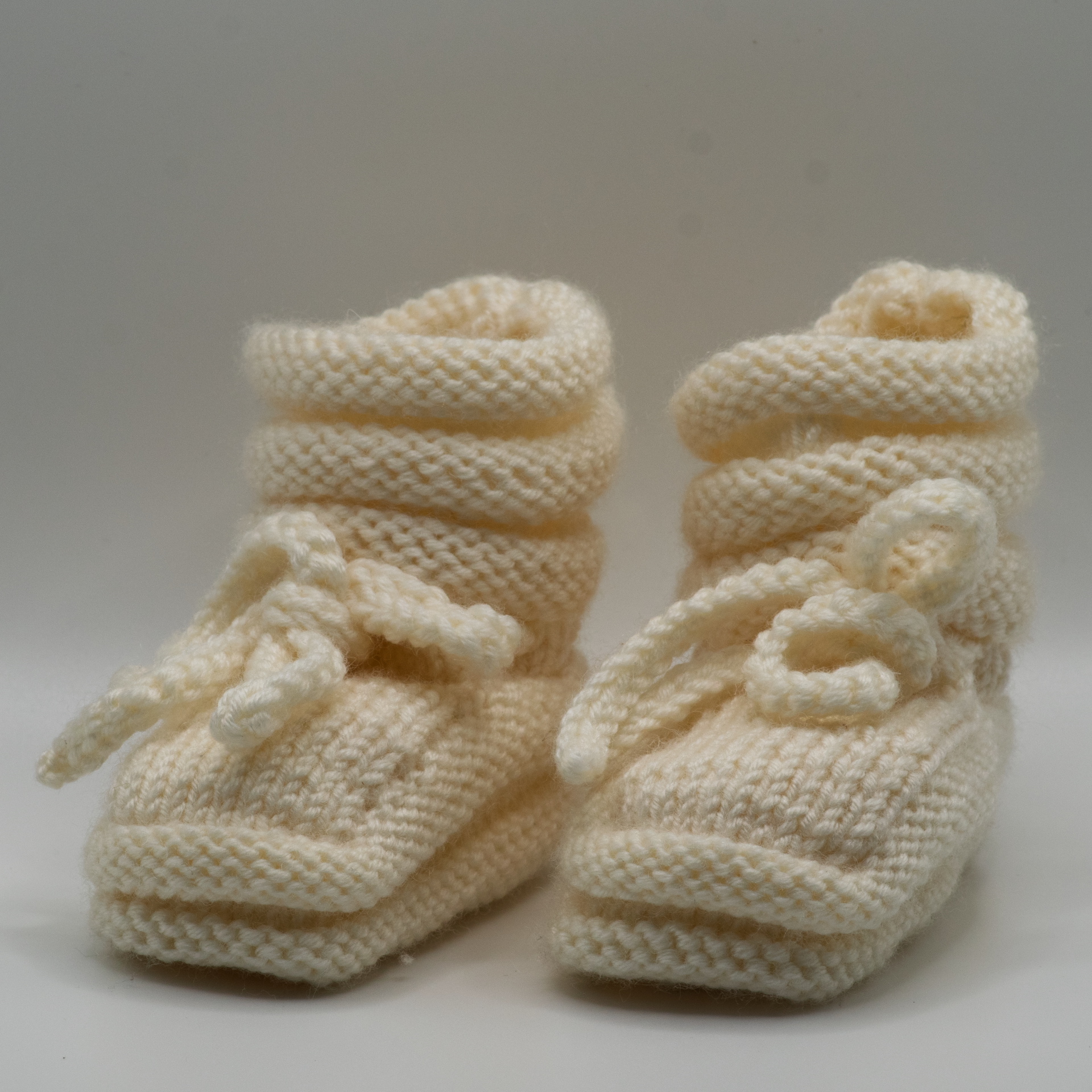 Merino babysloffen, room wit