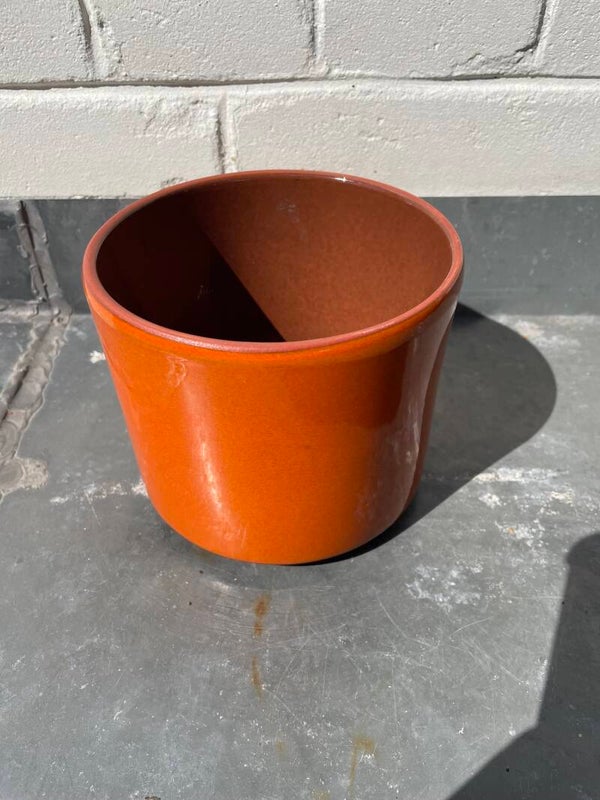 Keramieken oranje bloempot