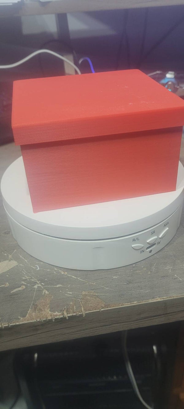 Small storage box with lid and 3 compartments.