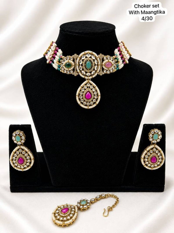 Gold kundan pearlchoker jewellery set with pearl earrings & tikka