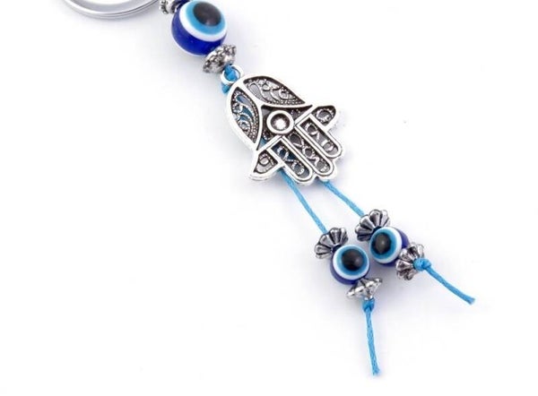 LLAVERO DE BISUTERÍA DE METAL CON AMULETO DE OJO TURCO