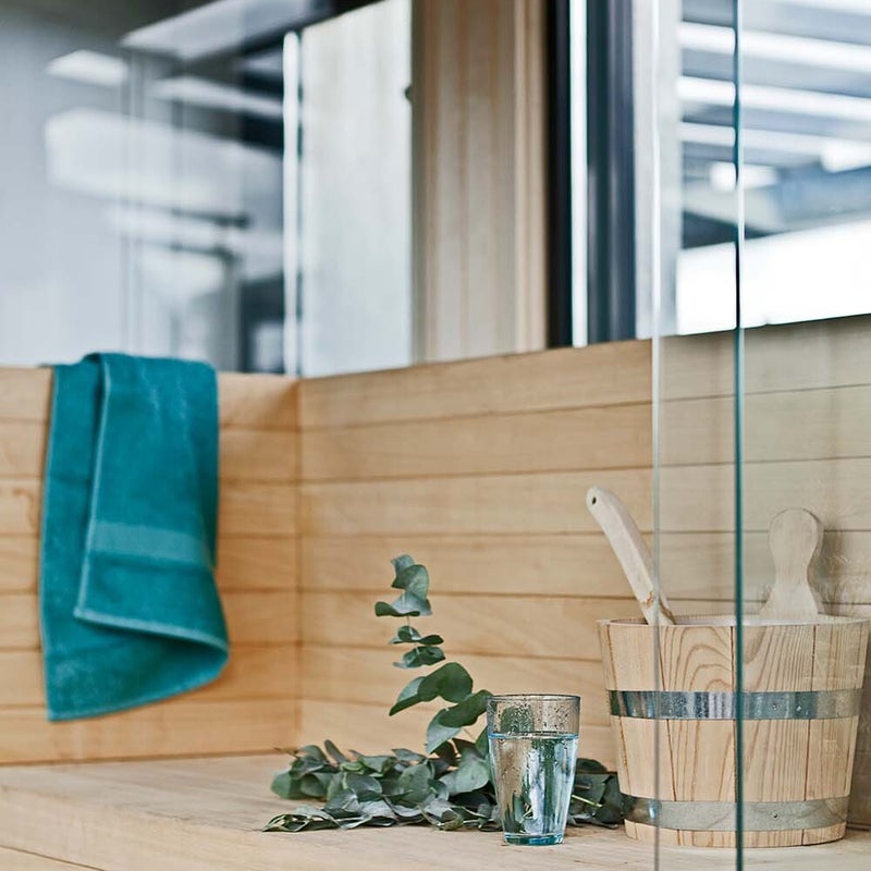 Ontwerp sauna penthouse Amsterdam - kachel is achter zitje verwerkt