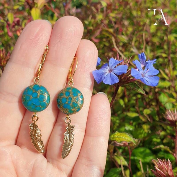 Turquoise gold feathers