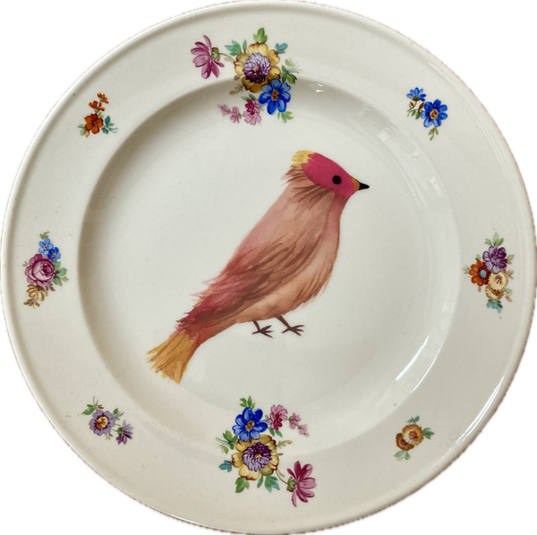 vogel op bord met bloemen