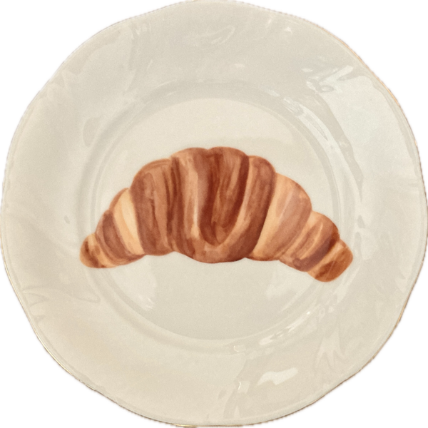 Croissant op bordje met gouden rand