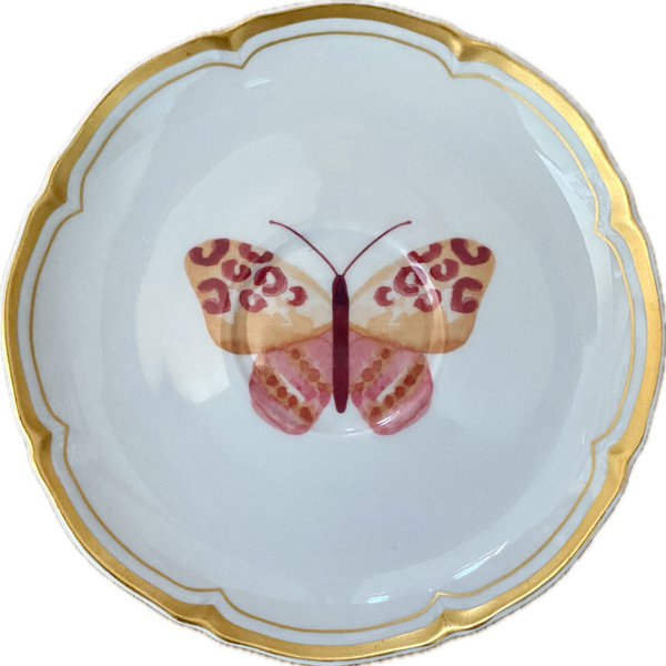 Vlinder op schotel met gouden randen