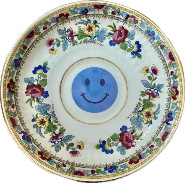 Blauwe smiley op schotel