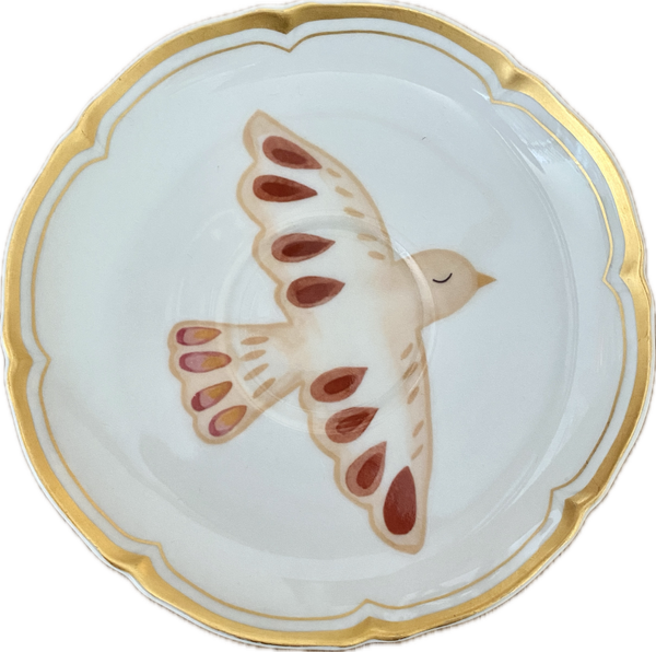 Vogel op schotel met gouden rand