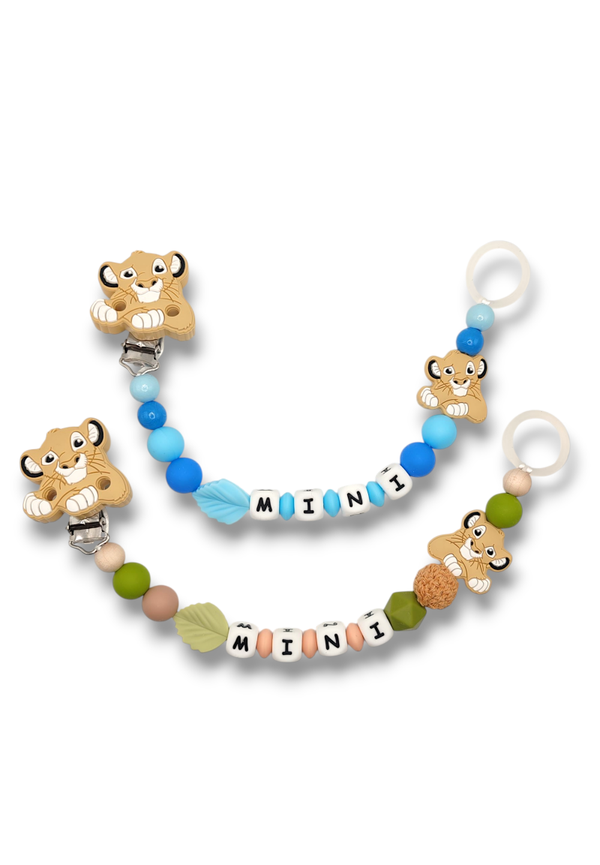 Tuttinauha, vaunulelu ja pururengas leijona