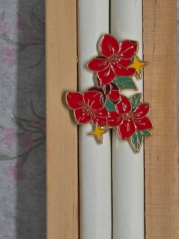 Pin's fleur étoilée