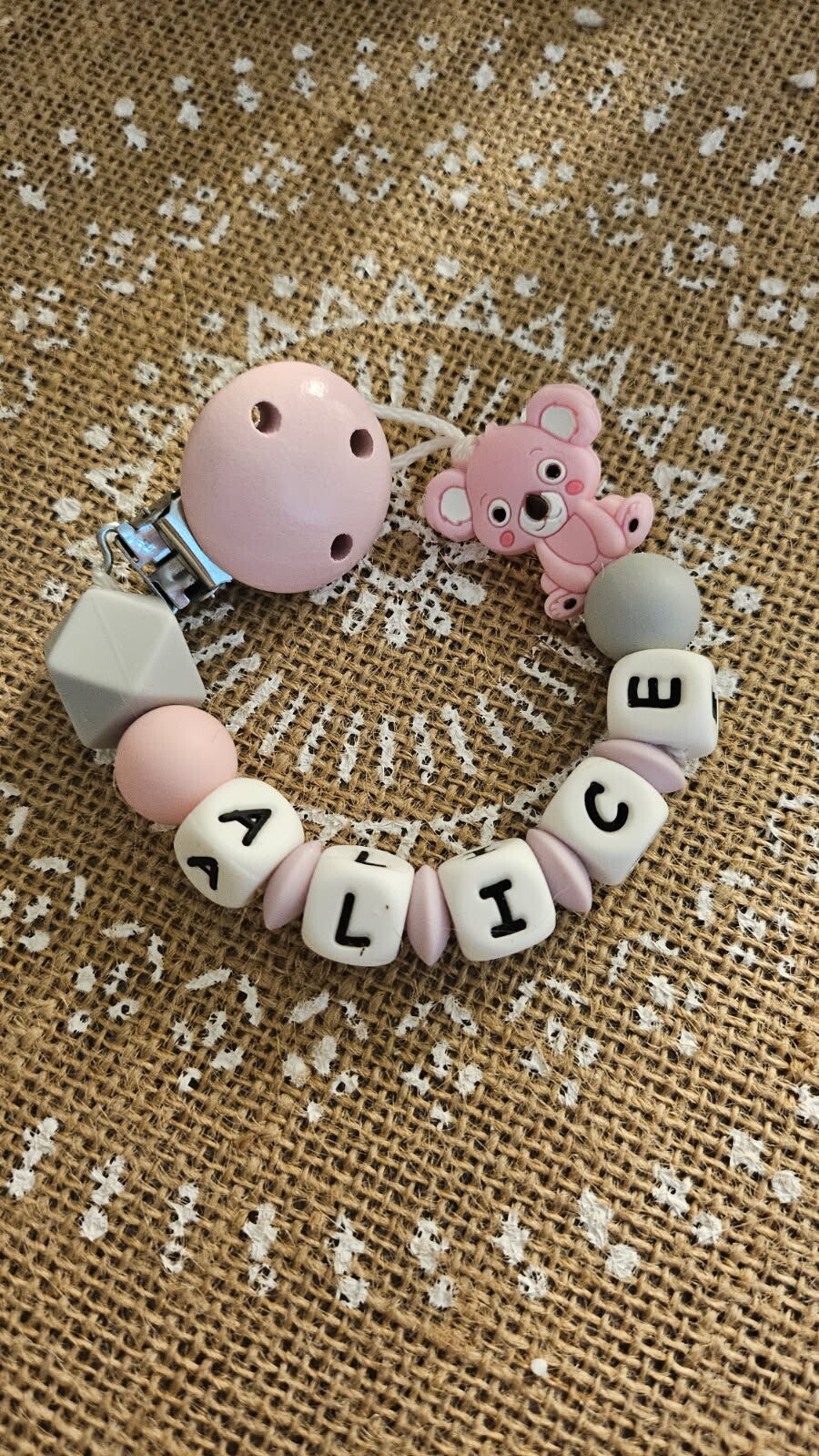 attache tétine Bouton Douceur