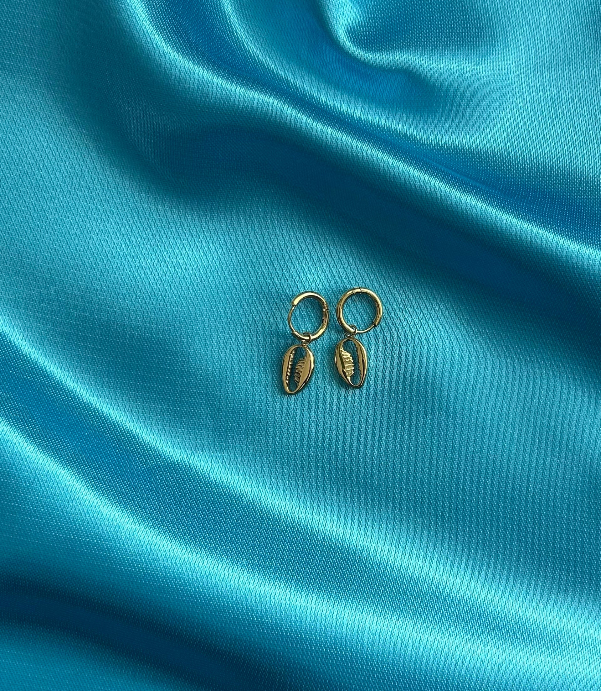 Gouden oorbellen met schelpjes