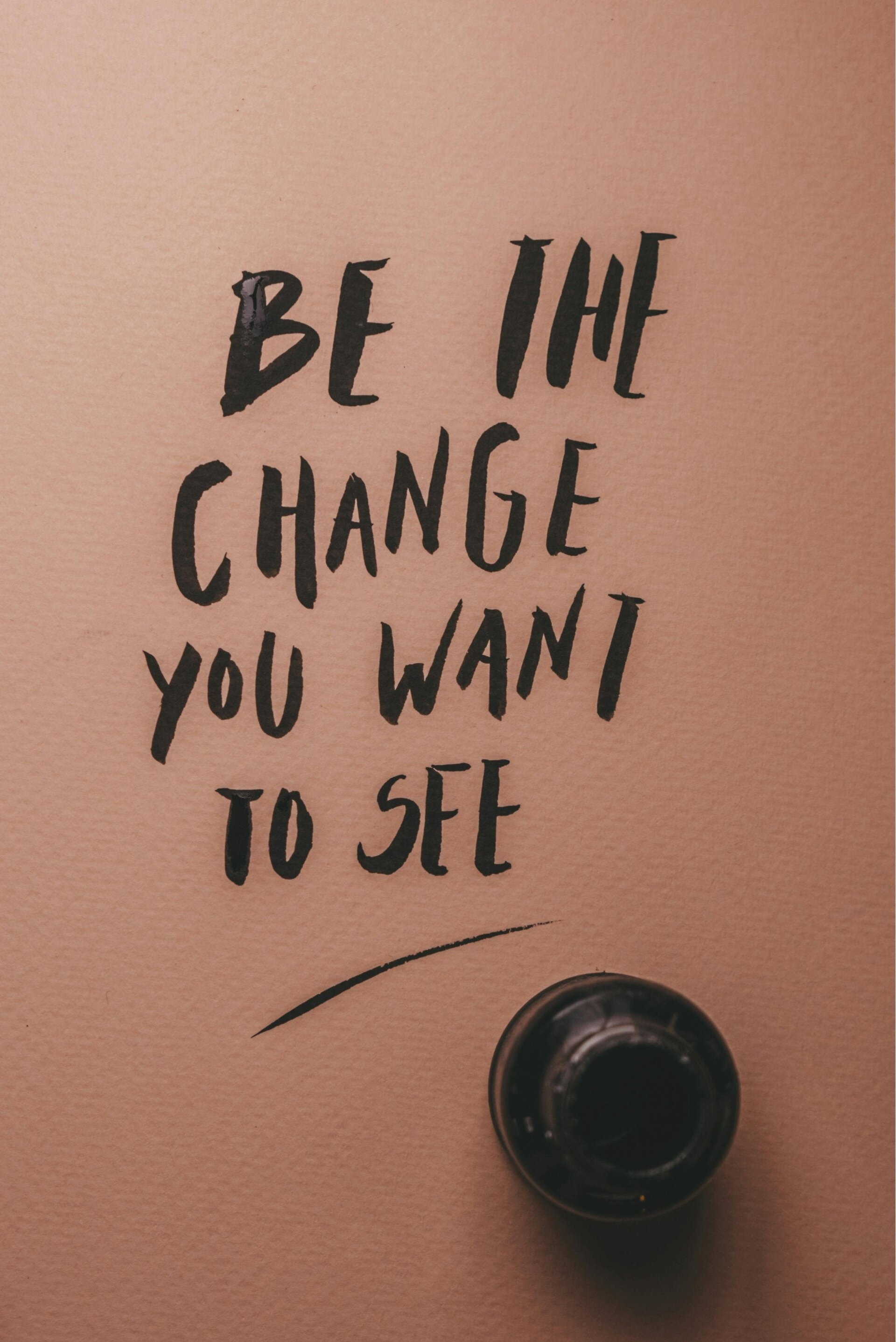 Geschreven tekst: be the change you want to see.