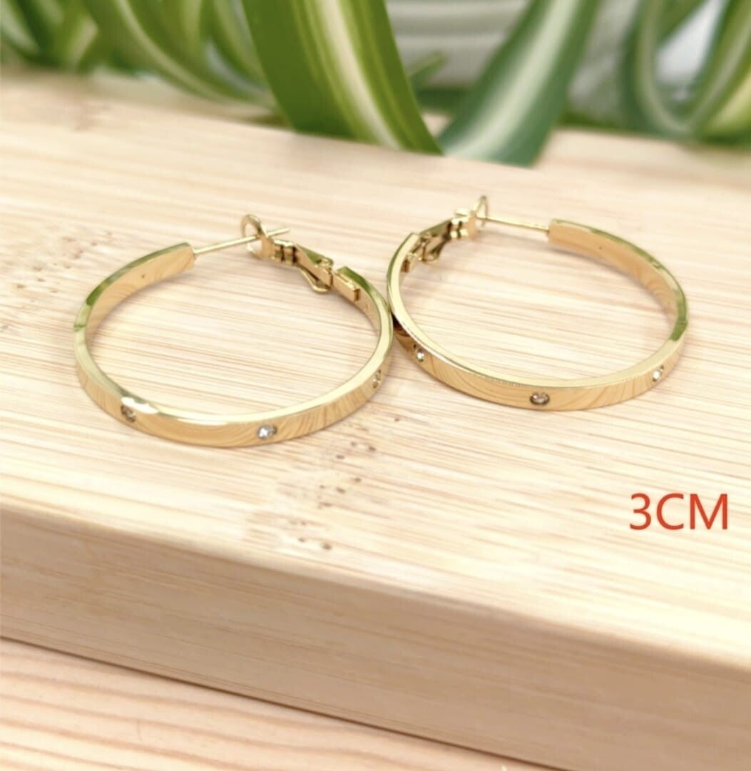 Gouden hoops met glitter steentjes