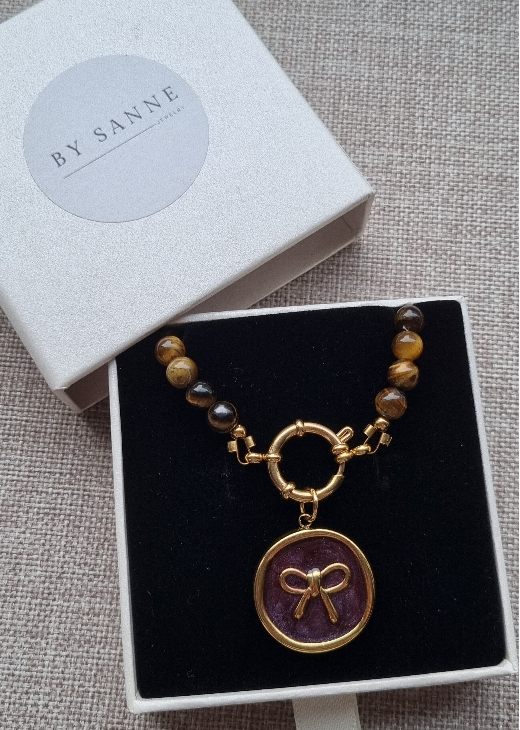 Statement ketting met strik en tijgeroog, bruin.