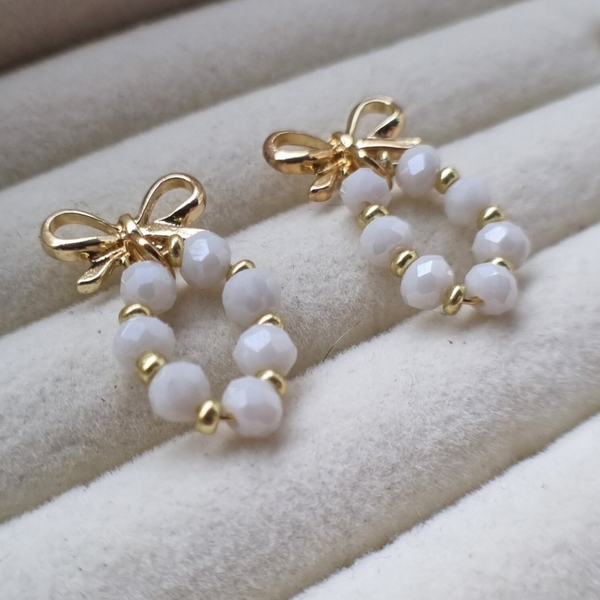 RVS oorbellen met kralen en een strik - AURELIA