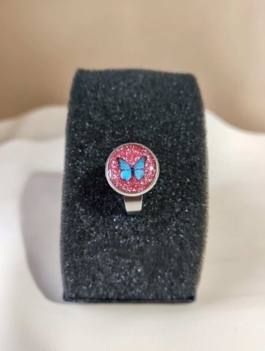 Verstellbarer Edelstahl-Ring mit Schmetterling und rosa Glitter-Harz