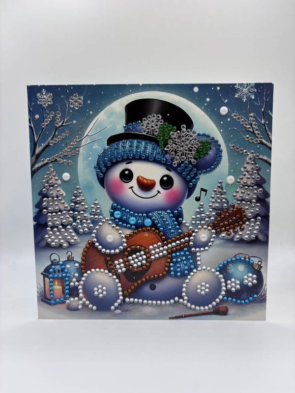 Noël (bonhomme de neige et guitare)