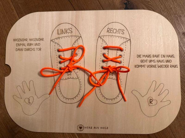 Aktivitätsplatte „Schuhe binden“