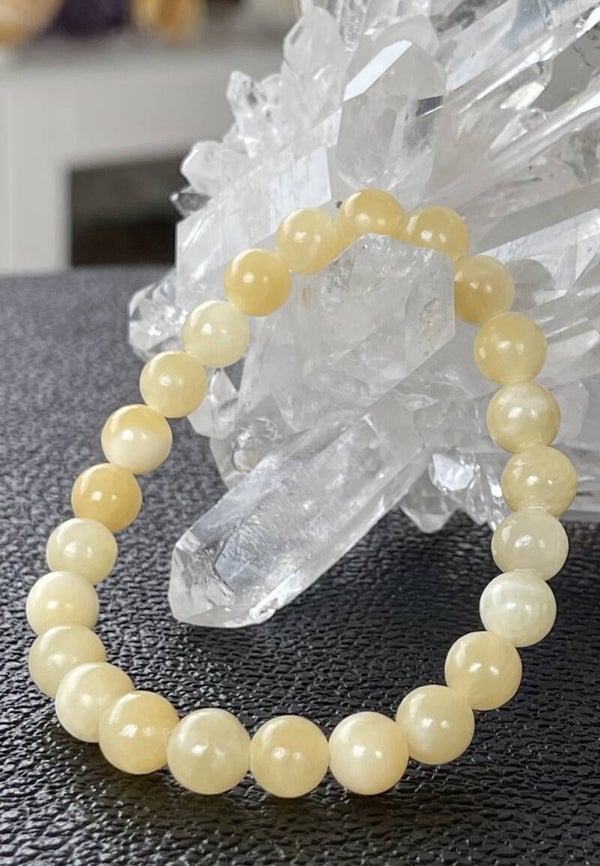 Gele Calciet armband met ronde kralen en elastiek 8,4mm