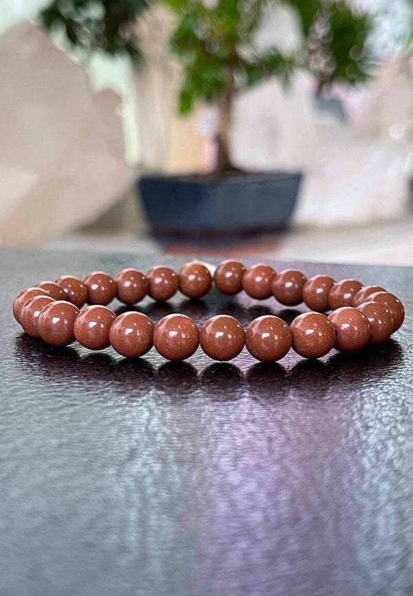 Goudsteen armband met ronde kralen en elastiek 8mm