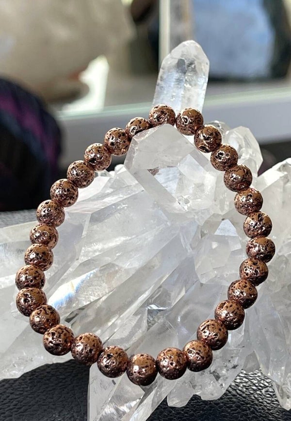Koperen armband met ronde kralen en elastiek 6,9mm