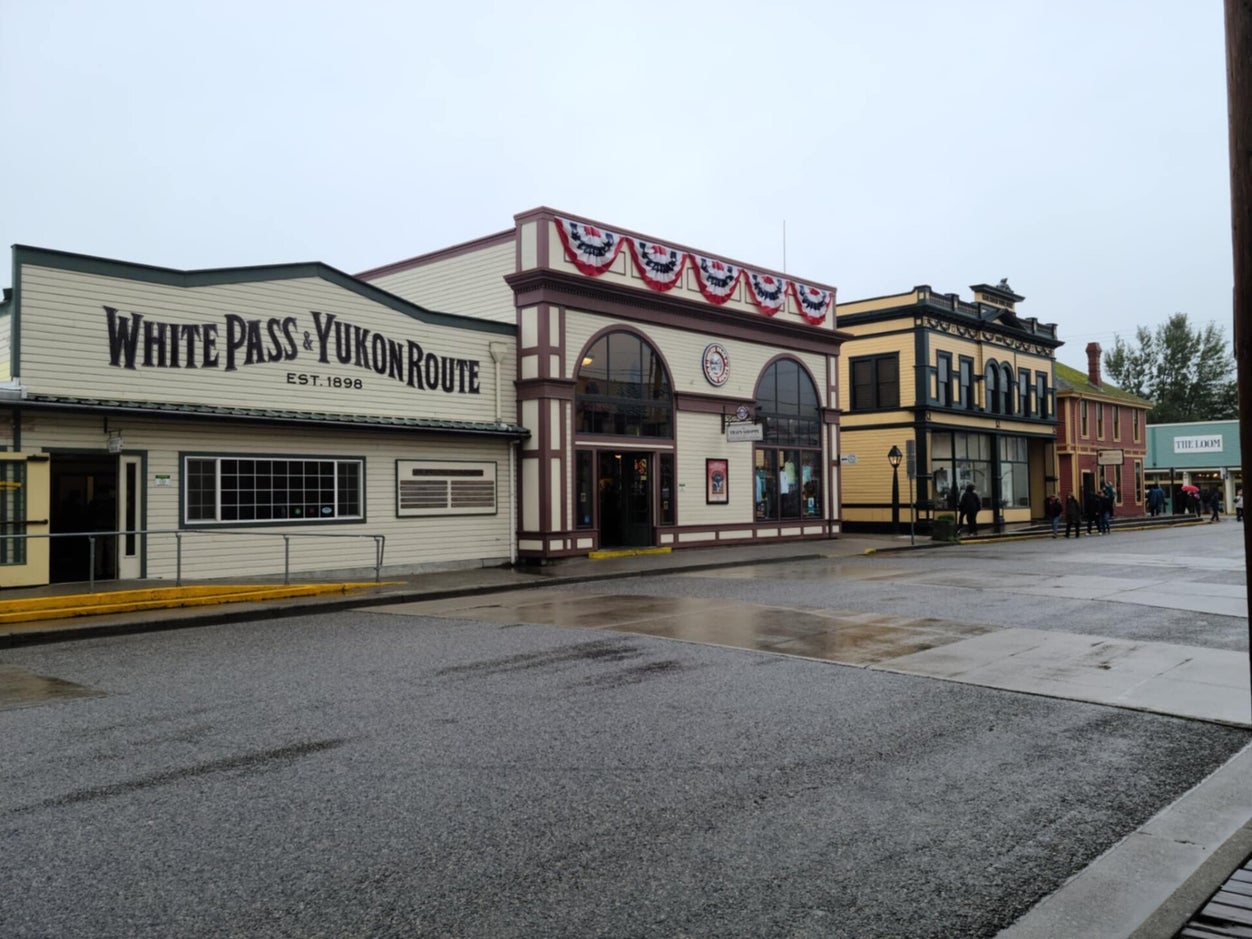 Historic downtown Skagway, Alaska with the White Pass and Yukon Route Railway depot and gold rush era storefronts