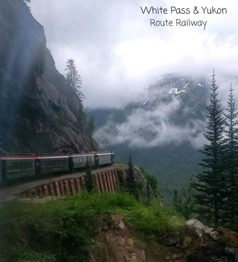 White Pass and Yukon Route Railroad climbing the mountains above Skagway, Alaska on a clear summer day