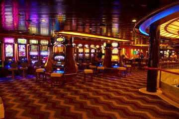 Cruise ship casino with slot machines and table games at sea