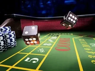 Craps table with dice and chips during rated casino play