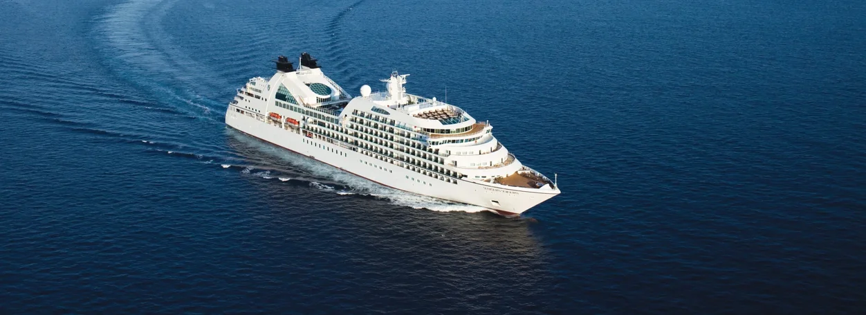 Seabourn luxury cruise ship at sea representing premium casino cruise programs and invitation-only sailings
