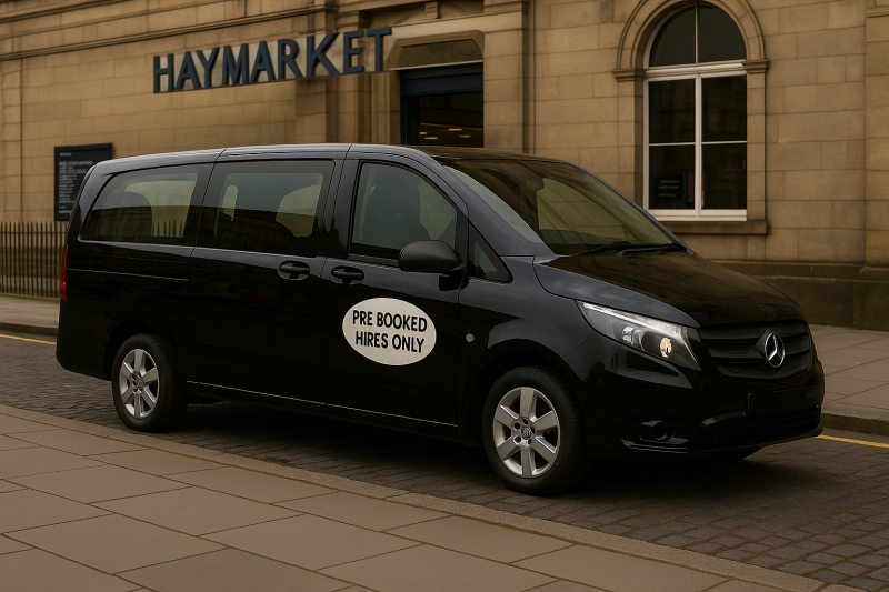 Black private hire taxi with “PRE-BOOKED HIRES ONLY” sticker parked outside Haymarket Station in Edinburgh.
