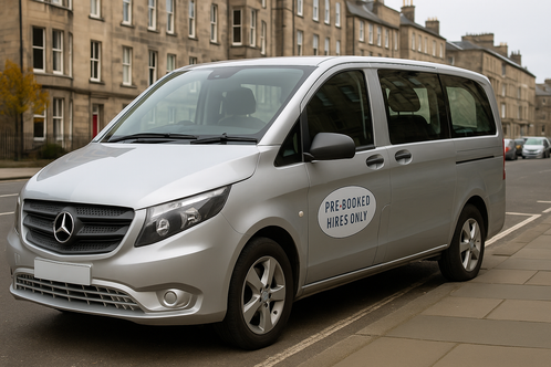 Alt-text: Silver Mercedes Vito taxi in Edinburgh with "PRE-BOOKED HIRES ONLY" door sticker, available for voice-search bookings via Siri and Alexa.