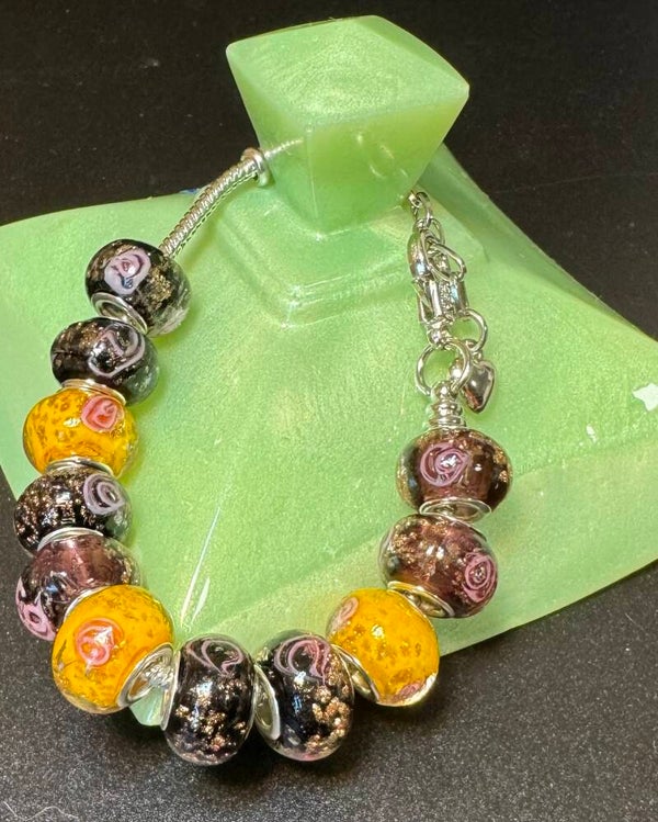 Elegant Beaded Bracelet with Yellow, Black, and Brown Accents
