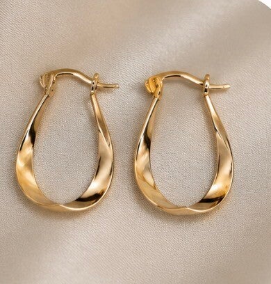 Sterling Silver Oval Hoop Earrings with Sculptural Twist