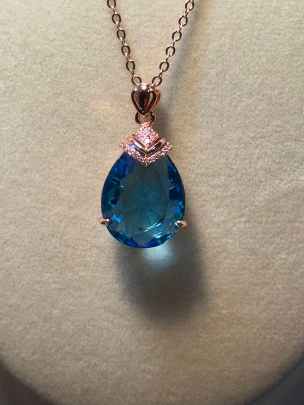 Blue and Rose Gold Teardrop Necklace with Faceted Gemstone