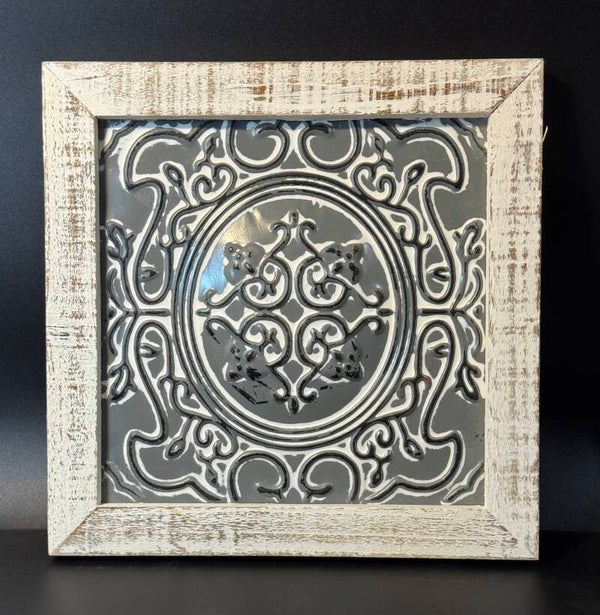 Elegant gray wall plaque with intricate design. Perfect for adding a touch of sophistication to any room.