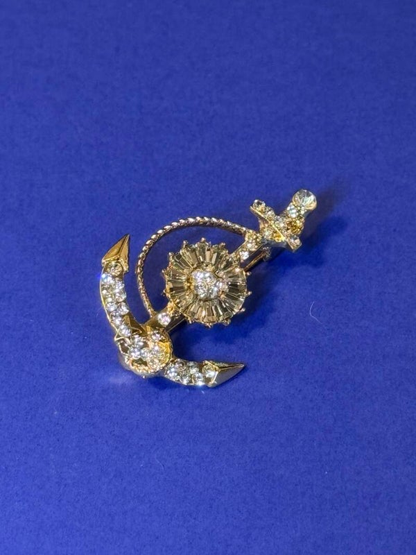 Elegant Gold and Crystal Brooch