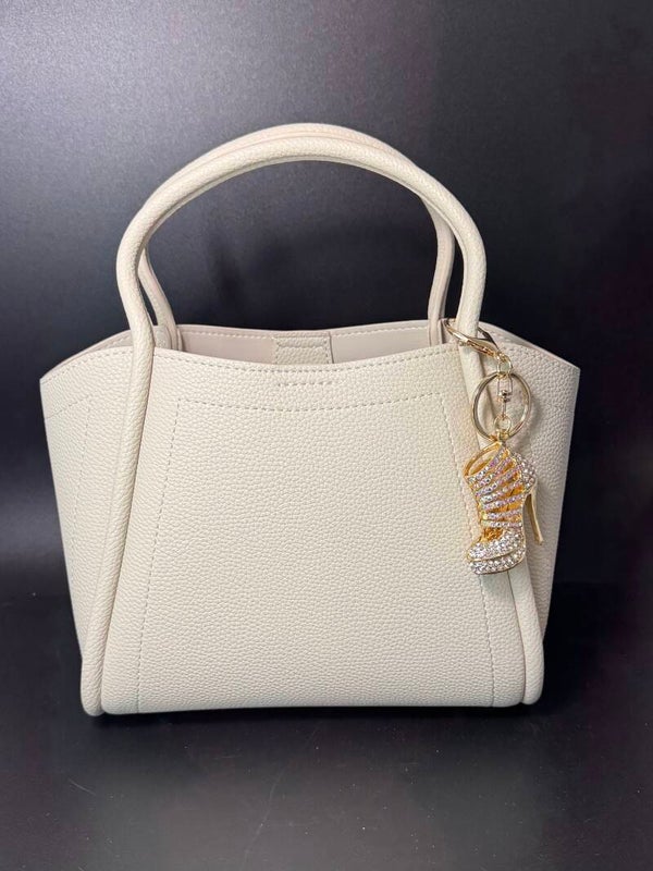 Elegant Cream Handbag with Gold Charm